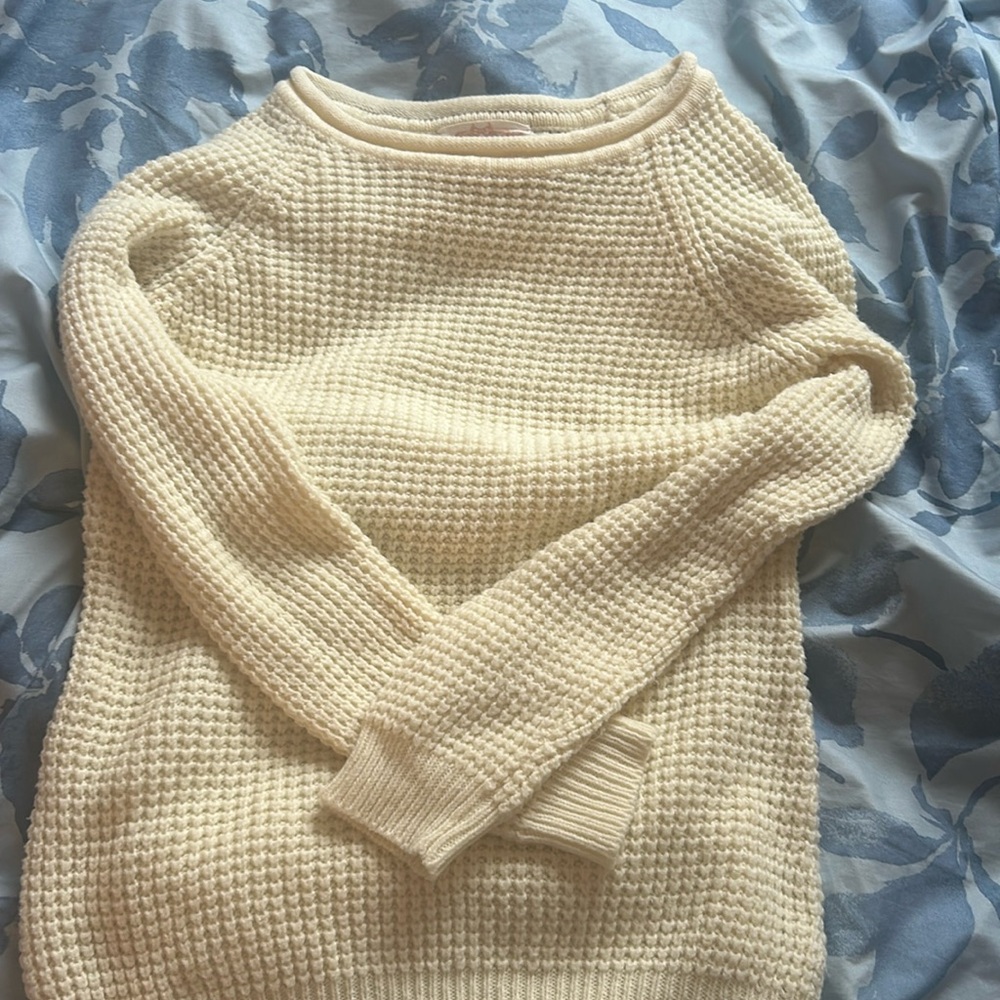 Lightly worn cream colored sweater